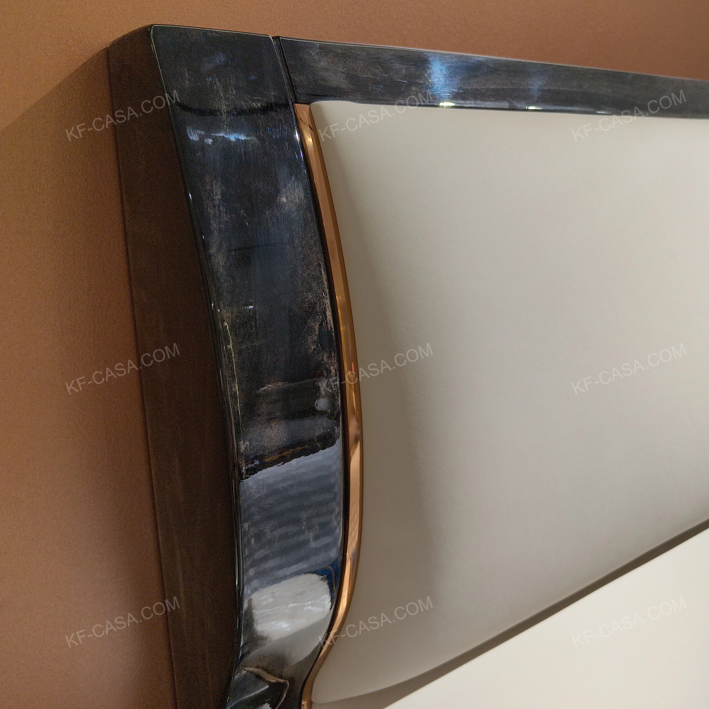 Soft Upholstered Bed with Embossed Brand Mark, Rich-Patterned Natural Wood Veneer Trim & Polished Gold Stainless Steel Accents